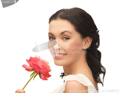 Image of young and beautiful woman with flower