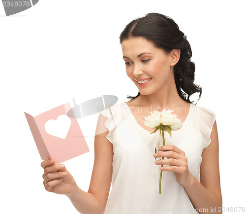 Image of young woman holding flower and postcard