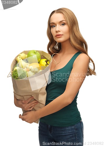 Image of woman with shopping bag full of fruits