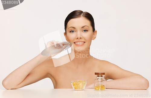 Image of woman with vitamins