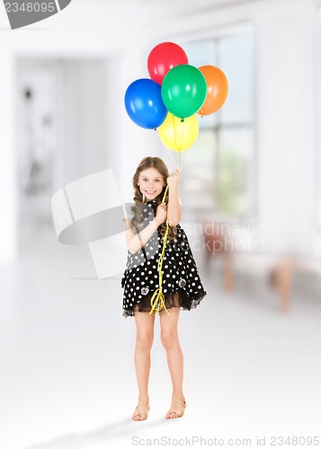 Image of happy girl with colorful balloons