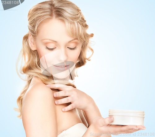 Image of beautiful woman with moisturizing creme