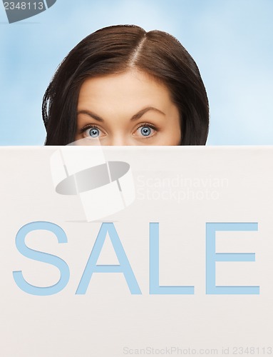 Image of lovely woman with sale billboard