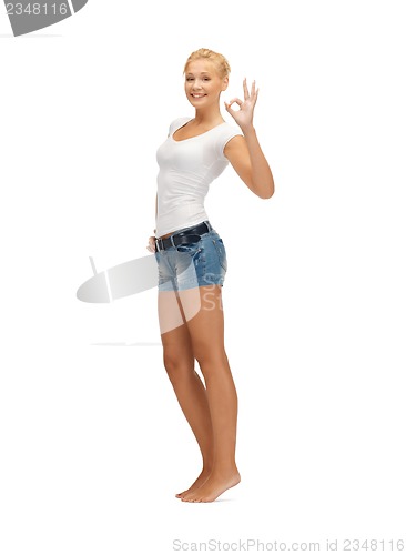 Image of teen girl in blank white t-shirt showing ok sign