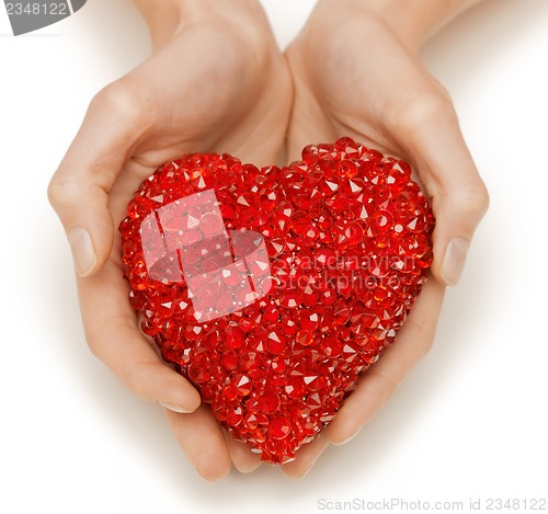 Image of woman hands holding heart