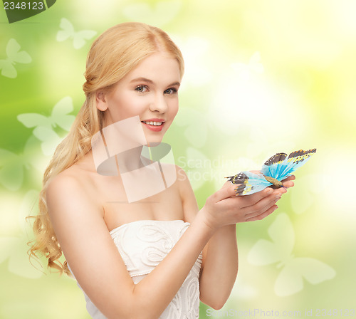 Image of woman with butterfly in hand