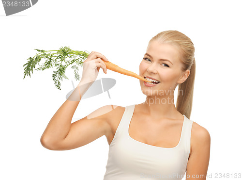 Image of healthy young woman biting carrot