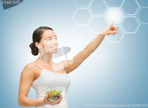 Image of woman with salad and virtual screen