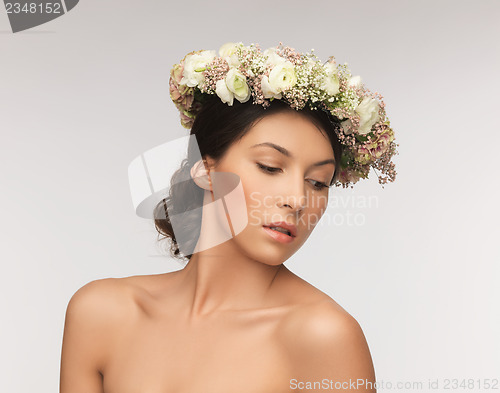 Image of woman wearing wreath of flowers