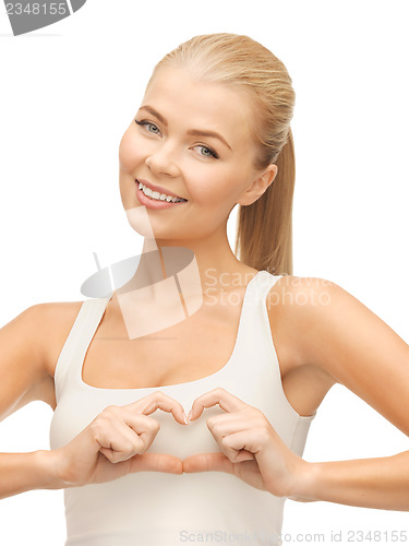 Image of woman showing heart shape gesture