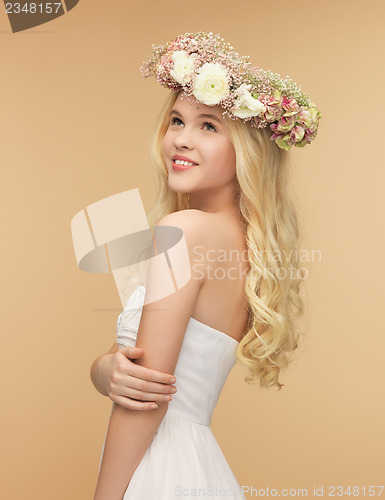 Image of woman wearing wreath of flowers