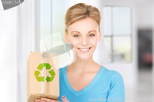 Image of woman with recyclable box