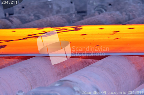 Image of hot steel on conveyor