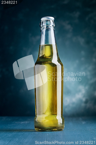 Image of alcoholic beverage bottle on blue background