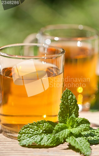 Image of herbal peppermint tea closeup macro outdoor summer
