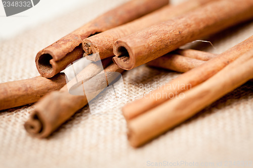 Image of aromatic cinnamon sticks detail macro closeup 