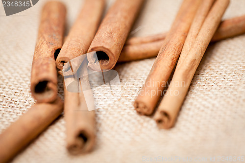 Image of aromatic cinnamon sticks detail macro closeup 