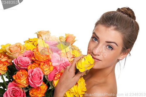 Image of attractive young smiling woman with flowers roses isolated