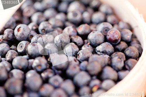 Image of healthy fresh blueberries macro closeup on market outdoor