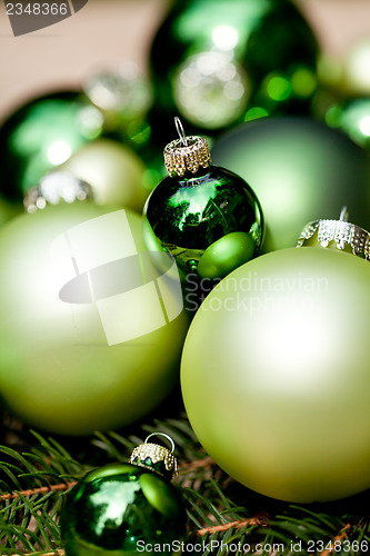 Image of shiny green christmas baubles closeup macro and tree 