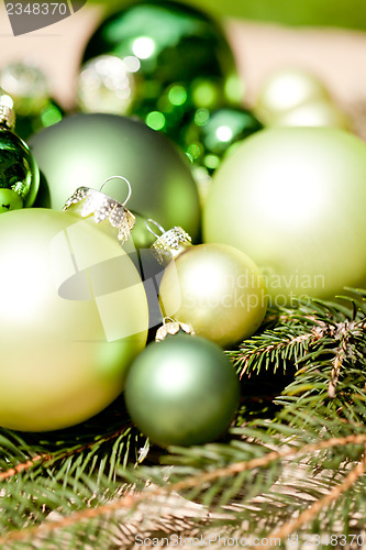 Image of shiny green christmas baubles closeup macro and tree 