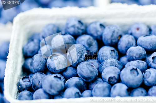 Image of healthy fresh blueberries macro closeup on market outdoor