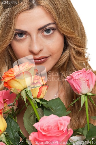 Image of attractive young smiling woman with flowers roses isolated