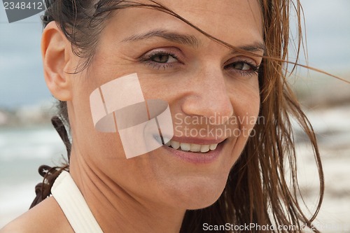 Image of attractive smiling adult woman outside in summer