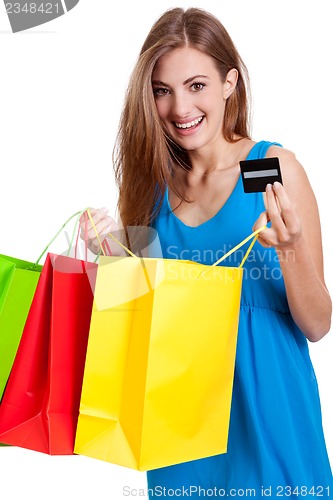 Image of happy young woman with colorful shopping bags visa isolated