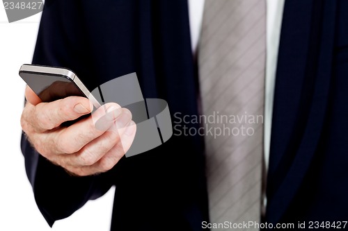 Image of adult businessman with smartphone mobilephone isolated