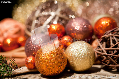Image of glittering christmas decoration in orange and brown natural wood 