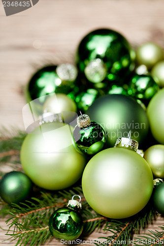 Image of shiny green christmas baubles closeup macro and tree 