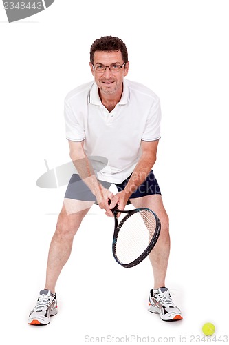 Image of smiling adult tennis player with racket isolated