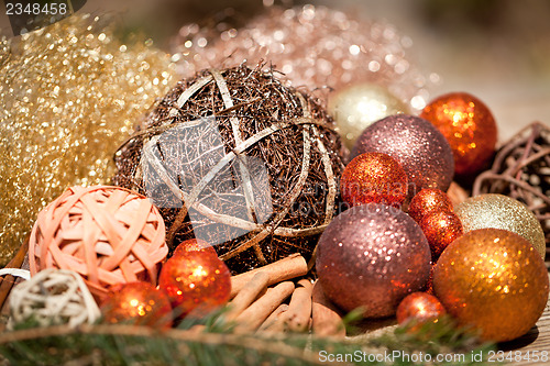 Image of glittering christmas decoration in orange and brown natural wood 