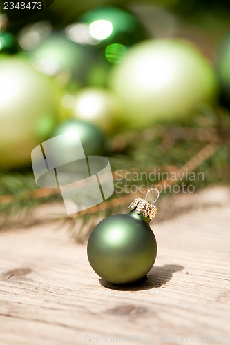 Image of shiny green christmas baubles closeup macro and tree 