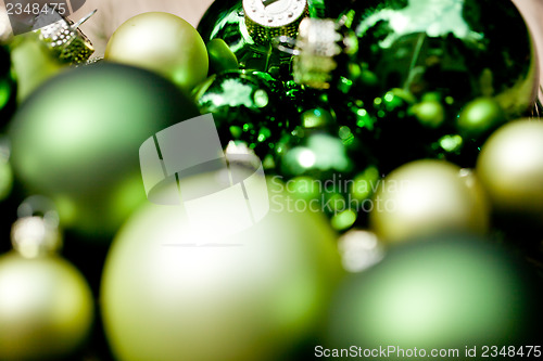 Image of shiny green christmas baubles closeup macro and tree 