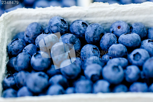 Image of healthy fresh blueberries macro closeup on market outdoor