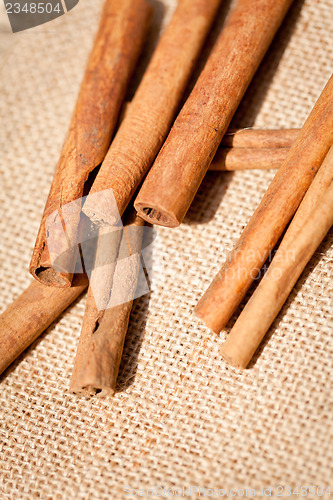 Image of aromatic cinnamon sticks detail macro closeup 