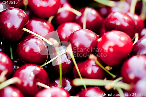 Image of sweet red cherry closeup macro on market outdoor