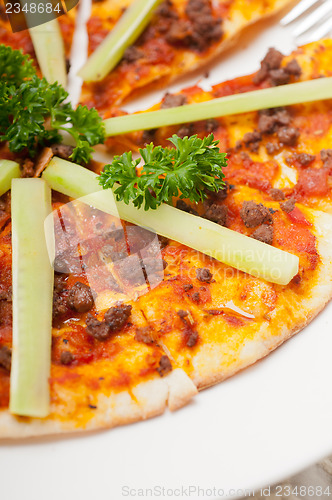 Image of Turkish beef pizza with cucumber on top