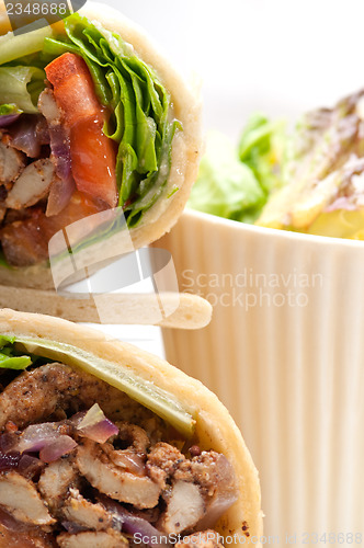 Image of kafta shawarma chicken pita wrap roll sandwich