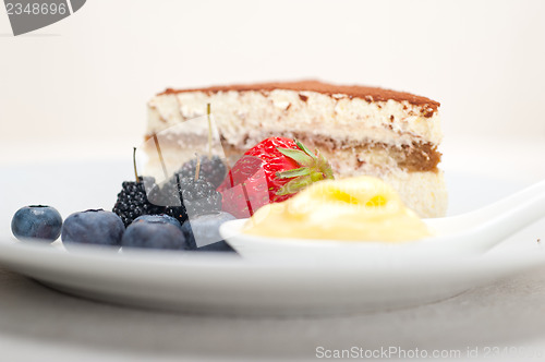 Image of tiramisu dessert with berries and cream