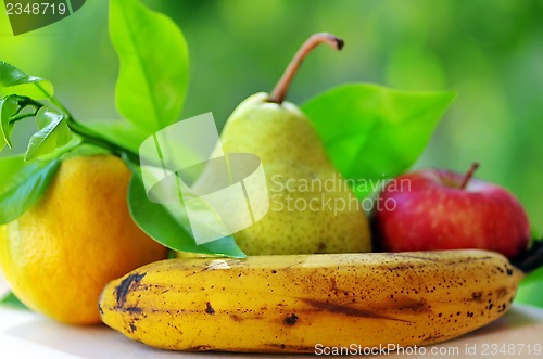 Image of Banana, pear, apple and orange fruits