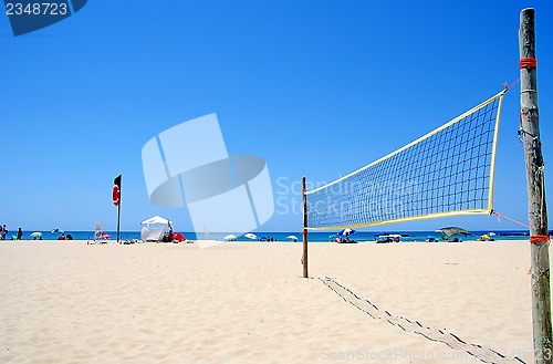 Image of Beach Volleyball net on sandy beach 
