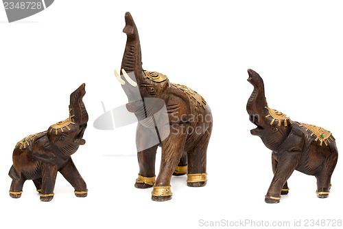 Image of Three wooden statues of elephants