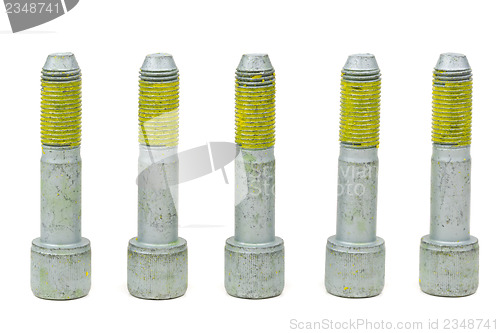 Image of Five bolts for the car with the yellow glue on the threads