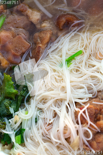Image of Thai noodle soup and pork meat