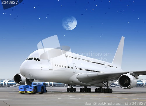 Image of plane in the bright of the moon