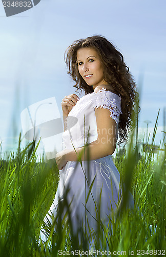 Image of woman on green field 