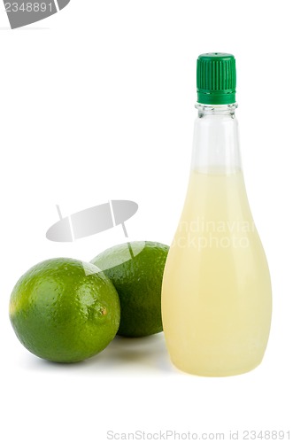 Image of Two limes and bottle of juice